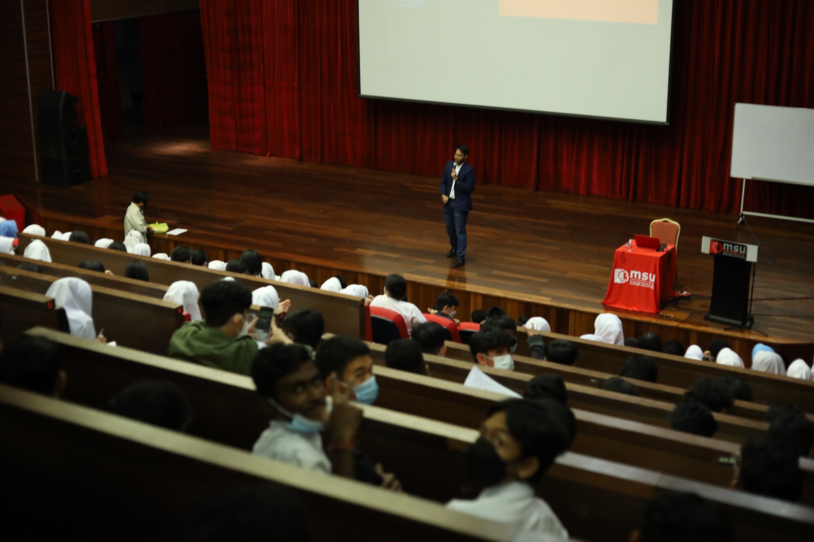 Students seated in a lecture hall during a seminar